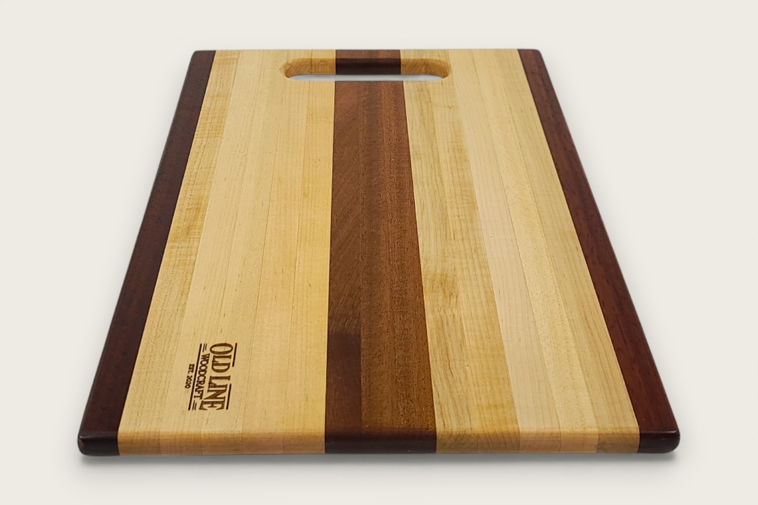Mahogany-accented maple chef board with light edge grain, horizontal pattern, rectangle shape, and tung oil finish.