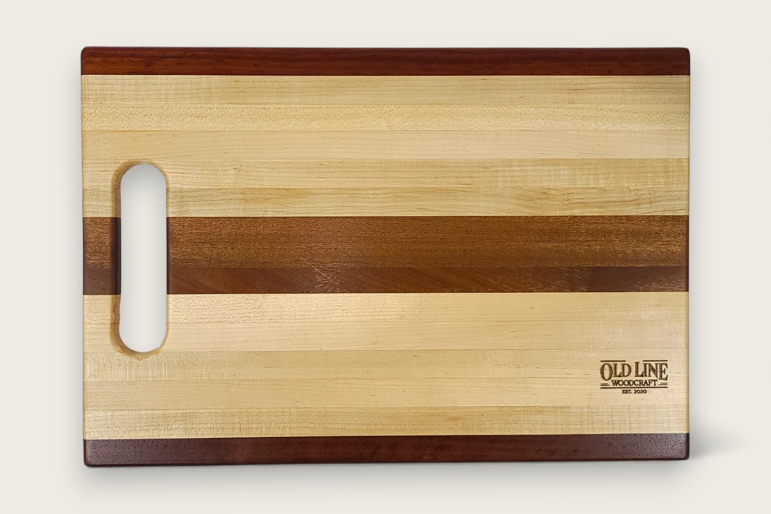 Mahogany-accented maple chef board with light edge grain, horizontal pattern, rectangle shape, and tung oil finish.