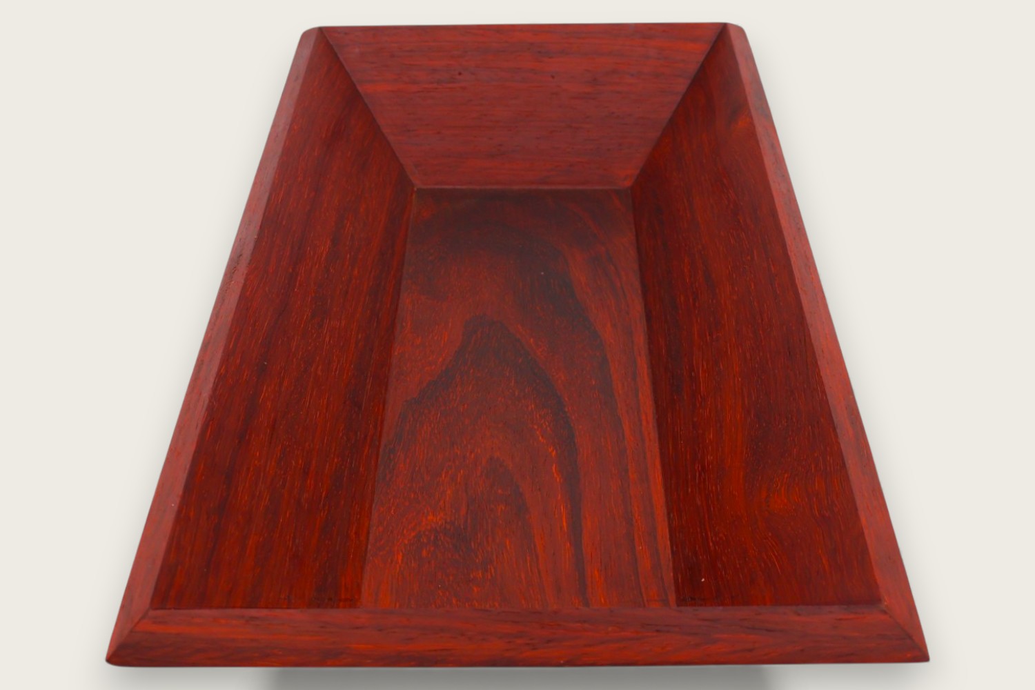 Padauk catch-all bowl with horizontal face grain, rectangular shape, warm reddish tones, and a tung oil finish.