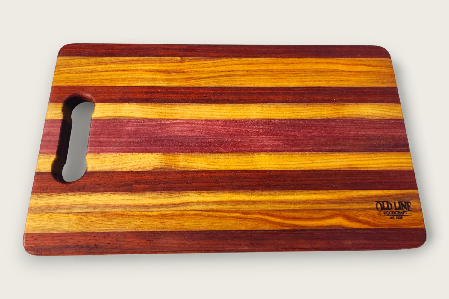 Canarywood edge-grain cutting board (#080) with horizontal pattern, rectangular shape, and warm golden tones.