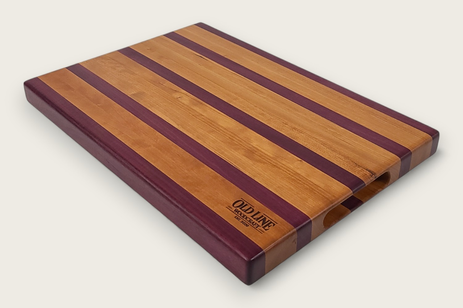 Cherry & Purpleheart Butcher Block (#100) with edge-grain cherry wood, purpleheart accents, and a rectangular shape.