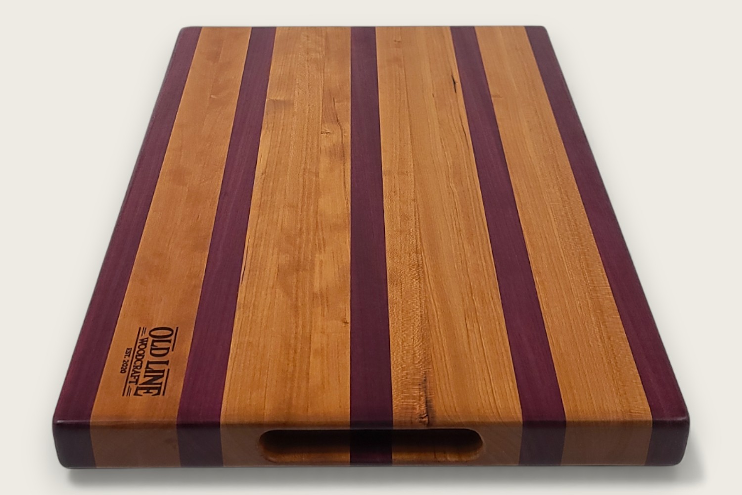 Cherry & Purpleheart Butcher Block (#100) with edge-grain cherry wood, purpleheart accents, and a rectangular shape.