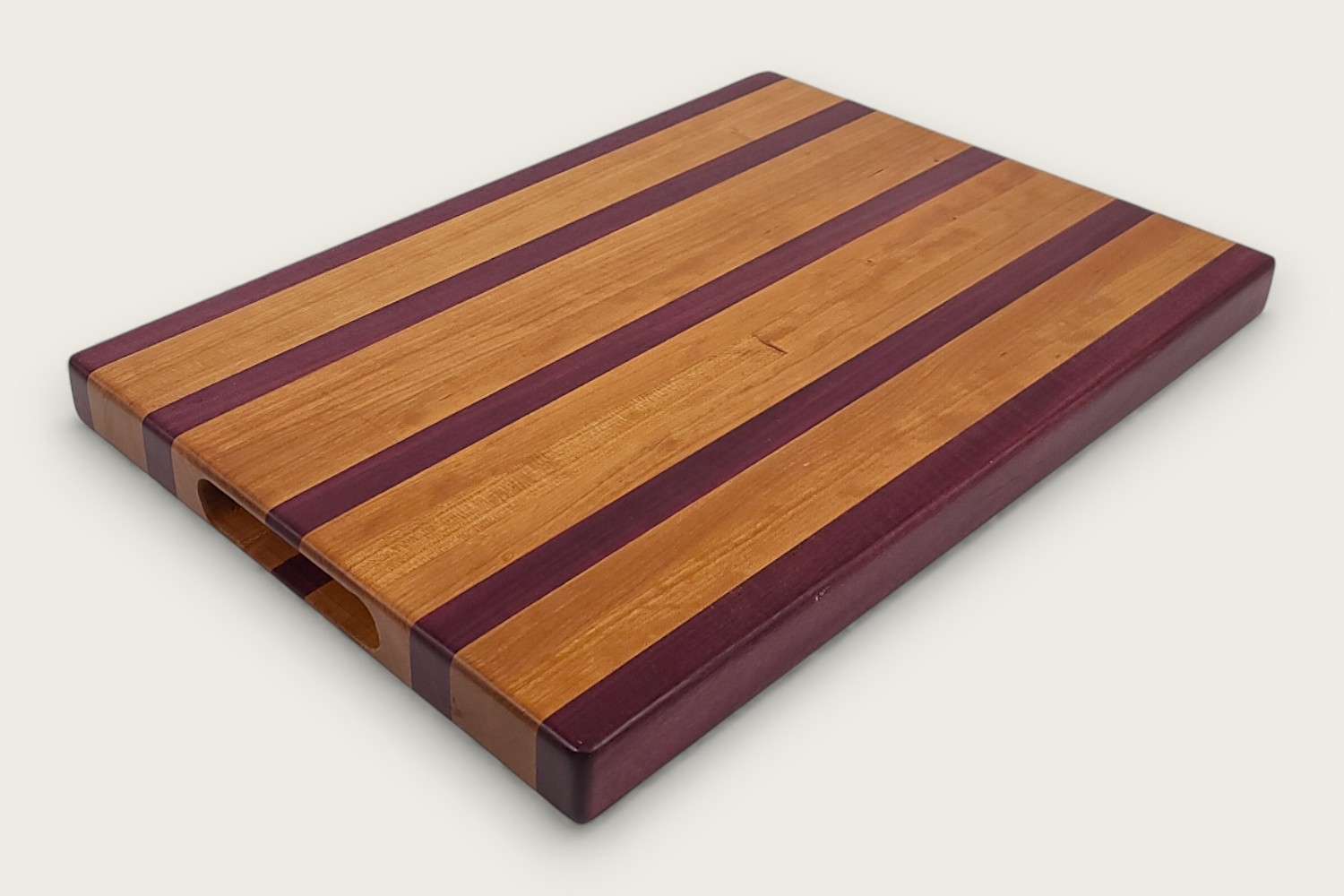 Cherry & Purpleheart Butcher Block (#100) with edge-grain cherry wood, purpleheart accents, and a rectangular shape.