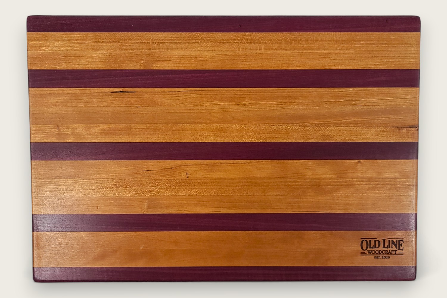 Cherry & Purpleheart Butcher Block (#100) with edge-grain cherry wood, purpleheart accents, and a rectangular shape.