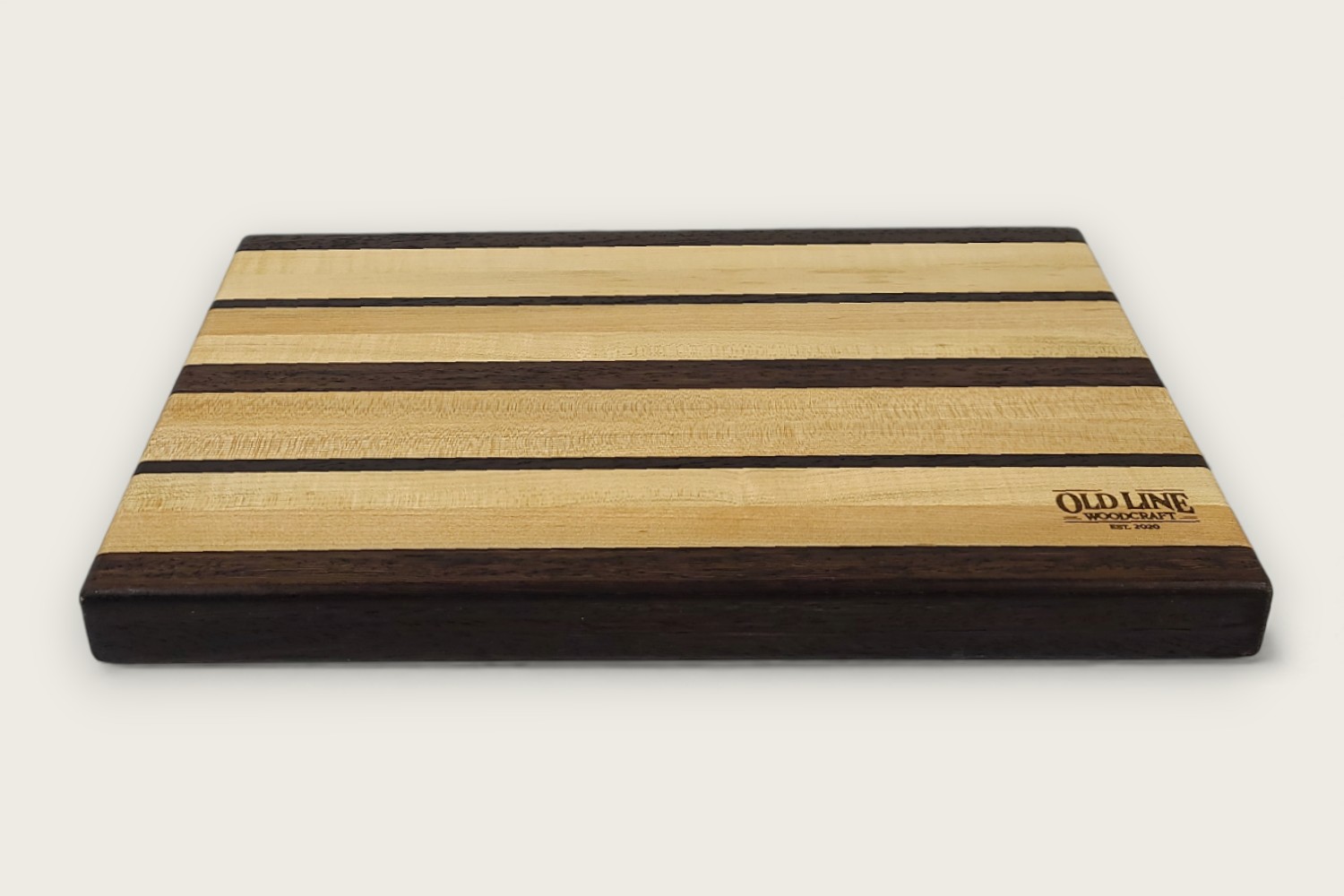 Maple & Wenge Butcher Block (#105) with light maple edge grain, dark wenge accents, and a rectangular shape.
