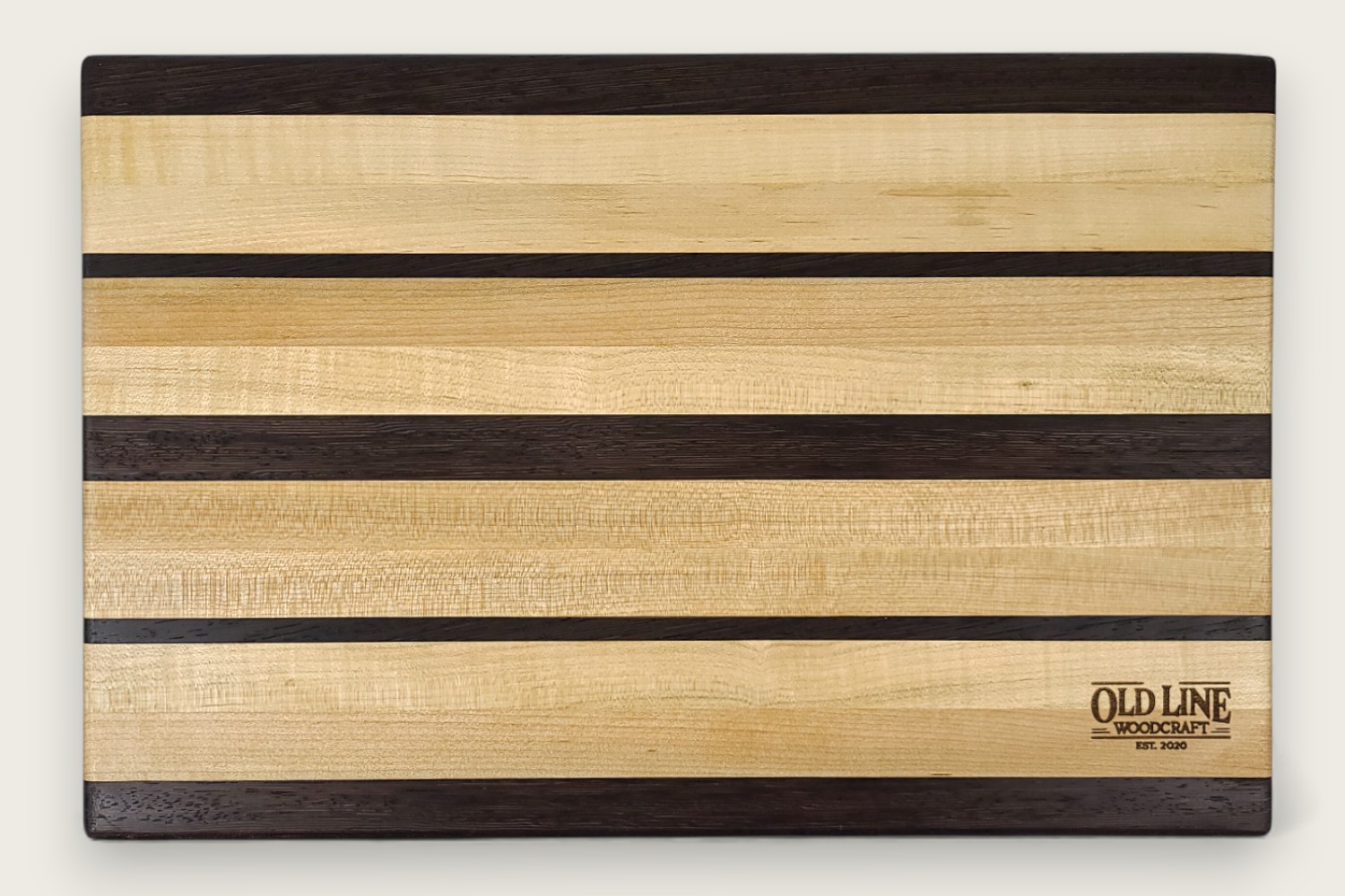 Maple & Wenge Butcher Block (#105) with light maple edge grain, dark wenge accents, and a rectangular shape.