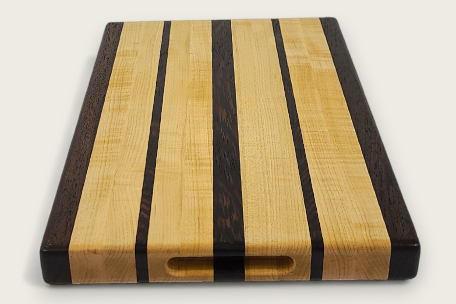 Maple & Wenge Butcher Block Board (#110) with light maple edge grain, dark wenge accents, and side scoop handles.