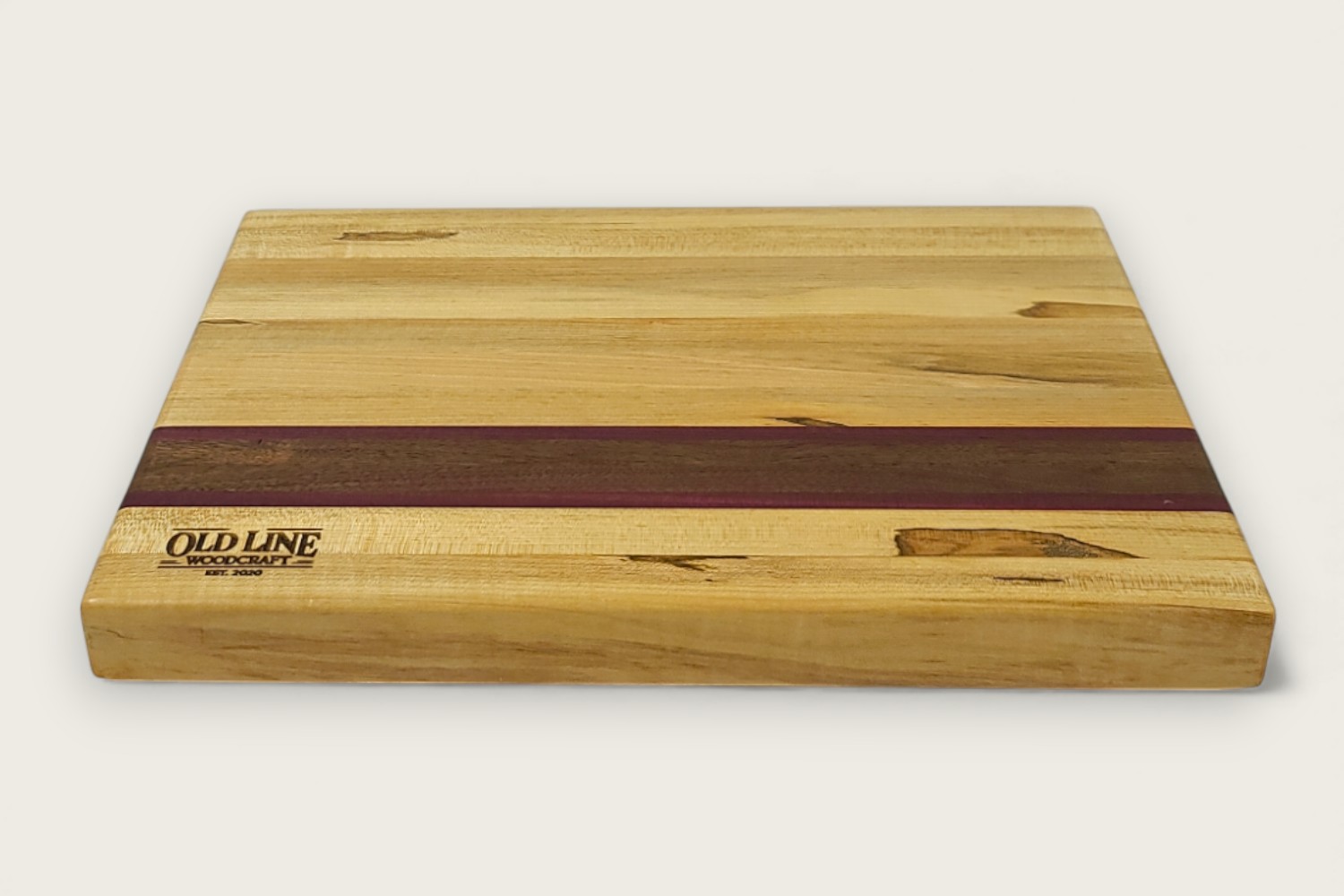 Spaulted Maple Butcher Block Board (#135) with light maple edge grain, horizontal pattern, and recessed handles.