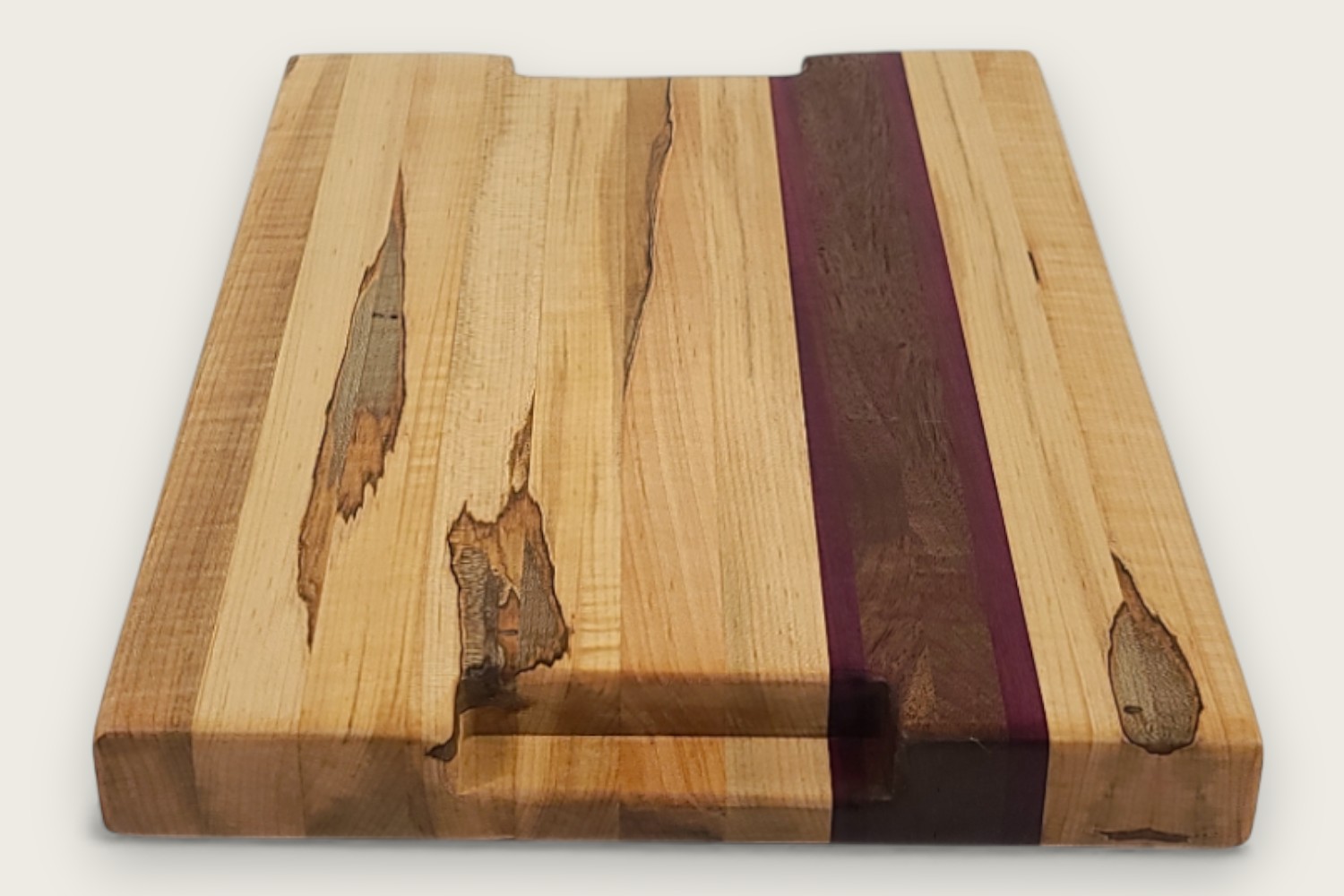 Spaulted Maple Butcher Block Board (#135) with light maple edge grain, horizontal pattern, and recessed handles.