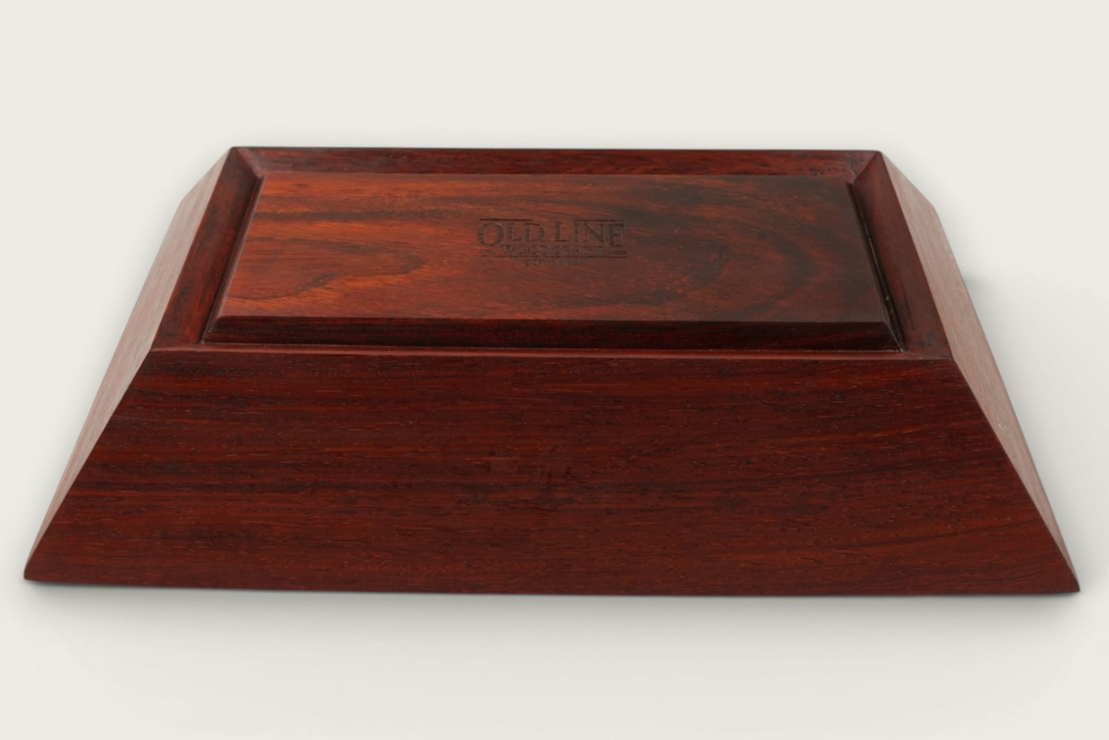Padauk catch-all bowl with horizontal face grain, rectangular shape, warm reddish tones, and a tung oil finish.