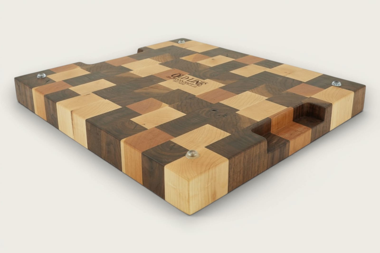 Walnut end-grain Calico chopping board with checker pattern, recessed handles, and rich brown tones.
