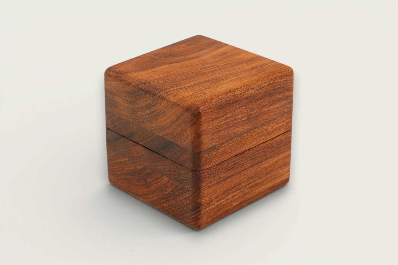 Rosewood ring box with square shape, face grain, warm reddish-brown tones, and a smooth tung oil finish.