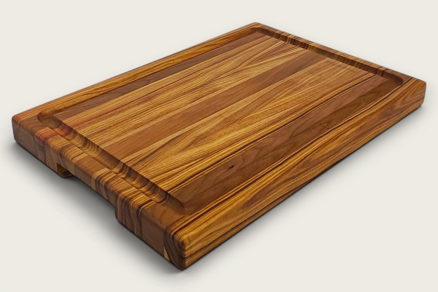 Canary and Cherry Butcher Block Board, edge-grain rectangle in tung oil, warm gold-brown tones, recessed handle.