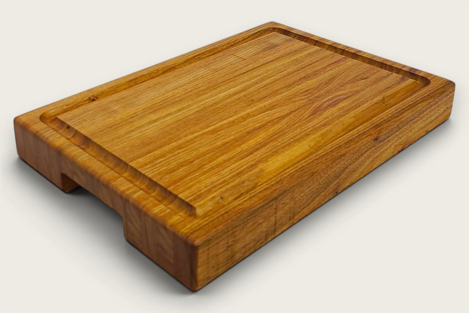 Canary Butcher Block Board in canarywood, edge-grain rectangle, tung-oil finish, warm gold tones, bottom recessed handle.