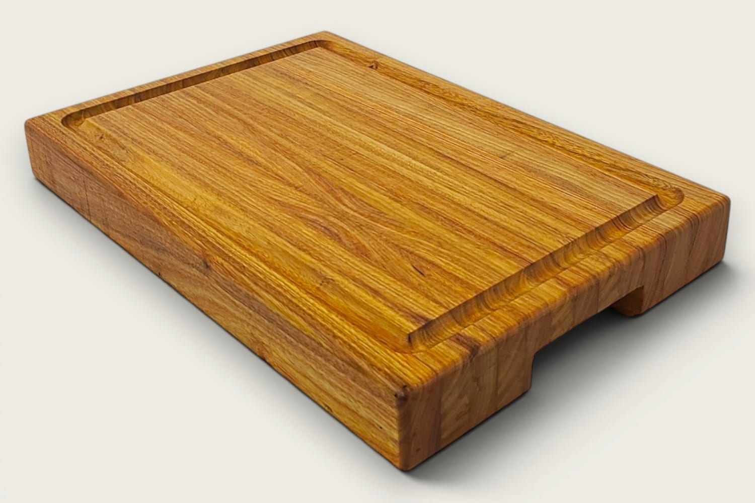 Canary Butcher Block Board in canarywood, edge-grain rectangle, tung-oil finish, warm gold tones, bottom recessed handle.