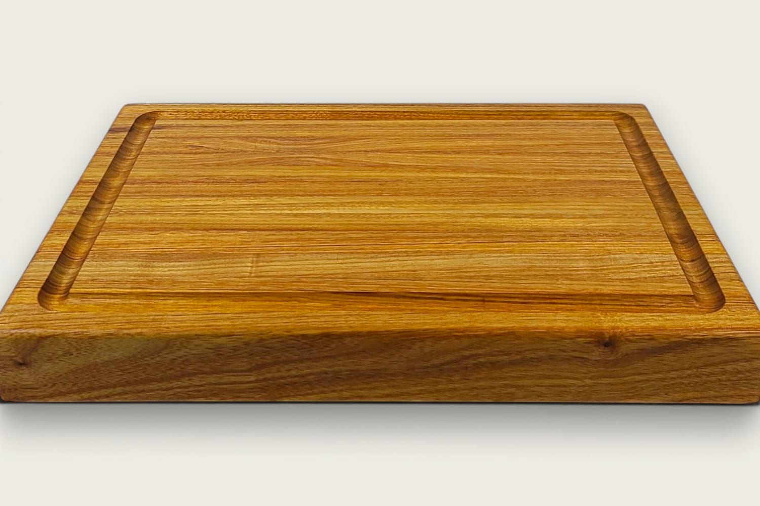 Canary Butcher Block Board in canarywood, edge-grain rectangle, tung-oil finish, warm gold tones, bottom recessed handle.