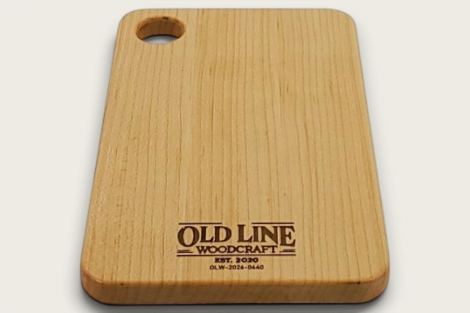Maple Prep Board cutting board in light maple, edge-grain horizontal, rectangle, tung-oil finish, cutout handle.