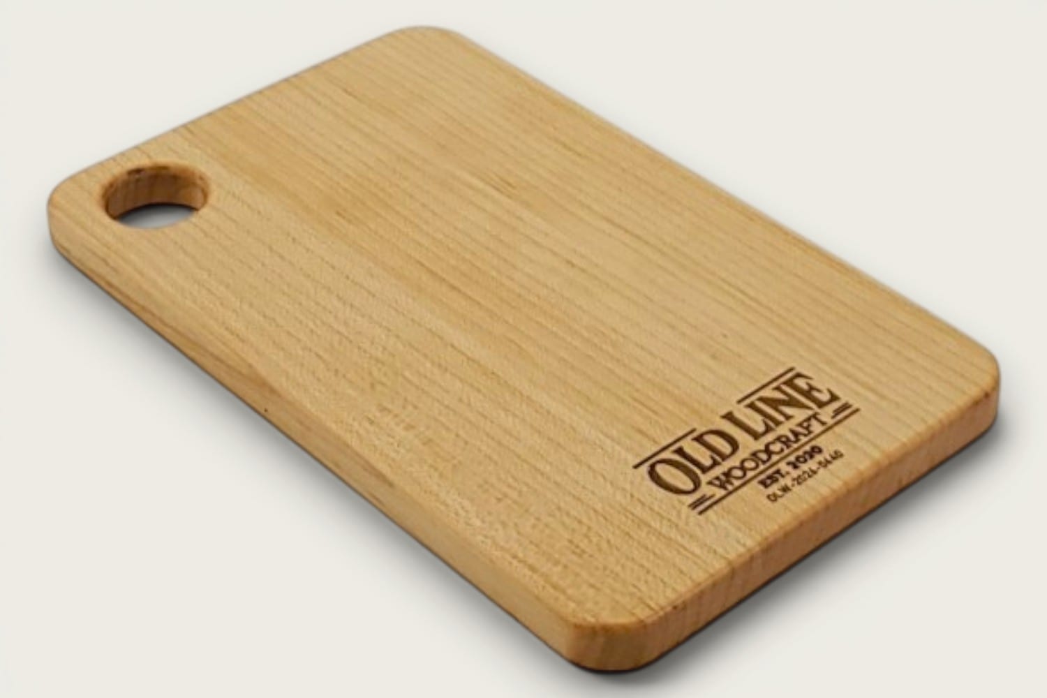 Maple Prep Board cutting board in light maple, edge-grain horizontal, rectangle, tung-oil finish, cutout handle.