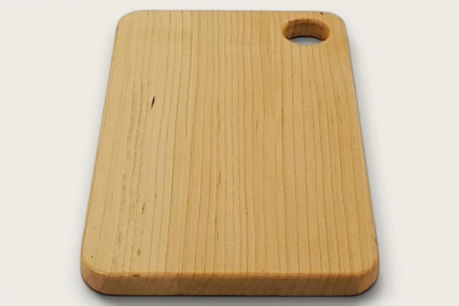 Maple Prep Board cutting board in light maple, edge-grain horizontal, rectangle, tung-oil finish, cutout handle.
