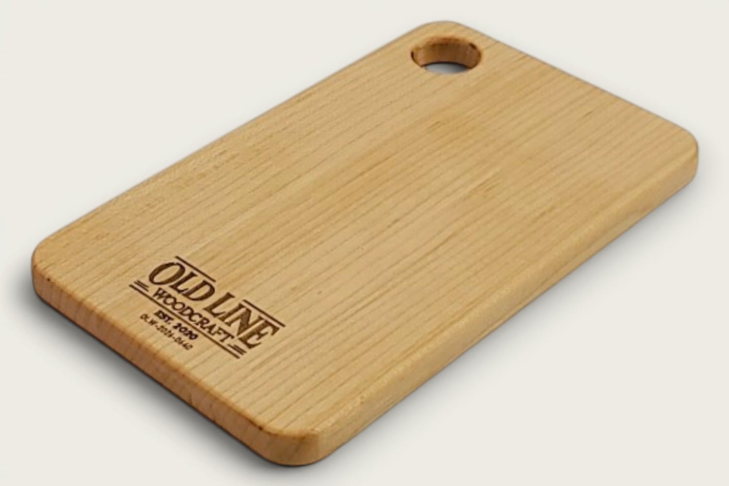 Maple Prep Board cutting board in light maple, edge-grain horizontal, rectangle, tung-oil finish, cutout handle.