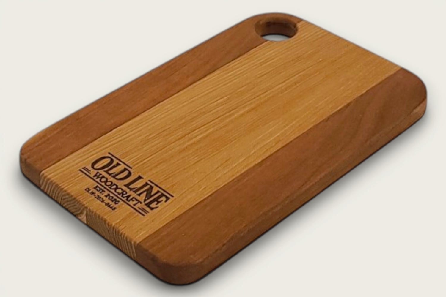 Hickory and Cherry Prep Board, edge-grain rectangle with tung-oil finish and a round cutout handle.