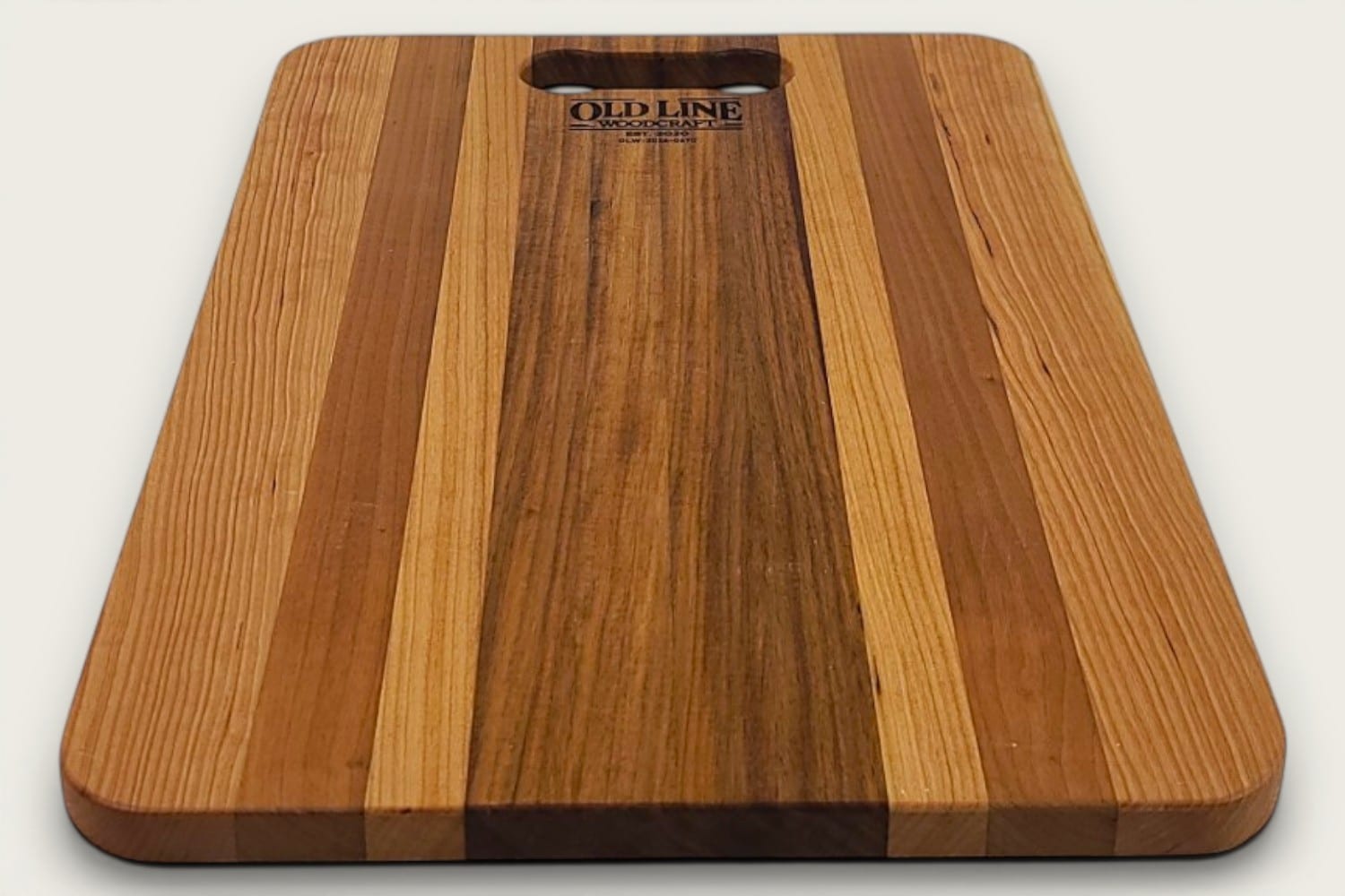 Canary and Cherry Pro Series Board cutting board, edge-grain rectangle in tung oil with OldLine bone handle.