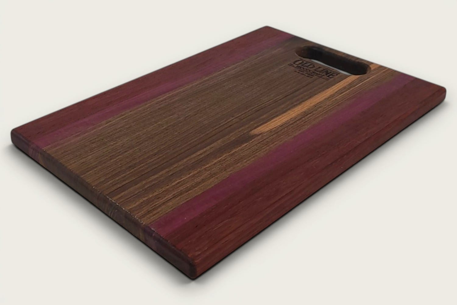 Walnut Padauk Purpleheart Pro Series Board, rectangular cutting board, edge grain, tung-oil finish, horizontal stripes and OldLine bone handle.