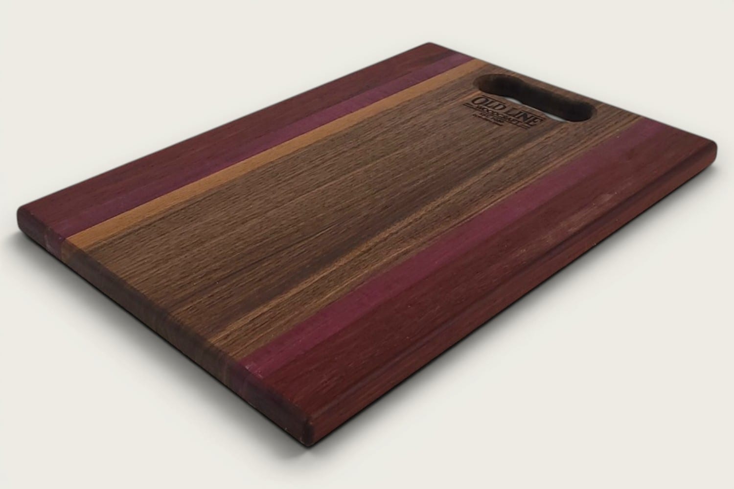 Walnut Padauk Purpleheart Pro Series Board, rectangular edge-grain cutting board with tung oil, horizontal stripes and bone handle.