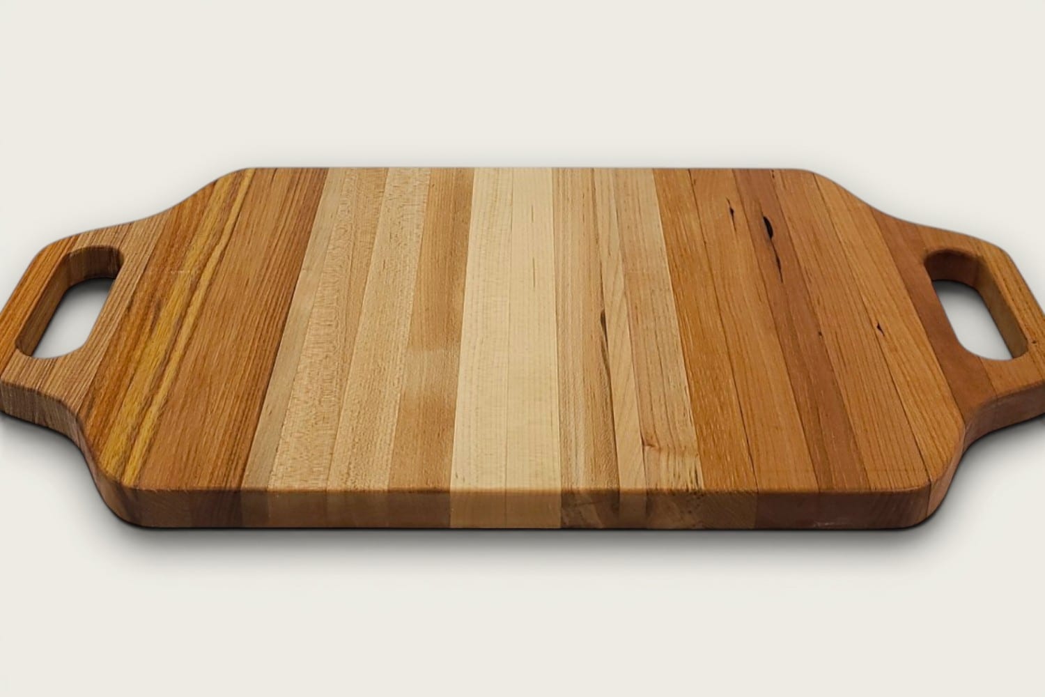 Maple Heritage Charcuterie Board, edge-grain with vertical pattern, tung-oil finish, cutout handles, maple with canarywood and cherry tones
