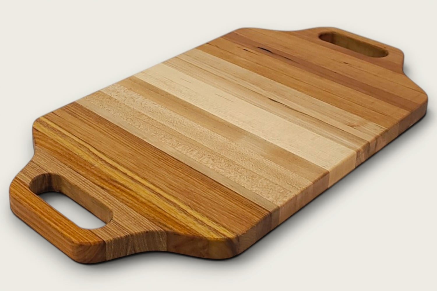 Maple Heritage Charcuterie Board in edge-grain vertical pattern, tung-oil finish, warm light tones, Heritage shape with cutout handle.