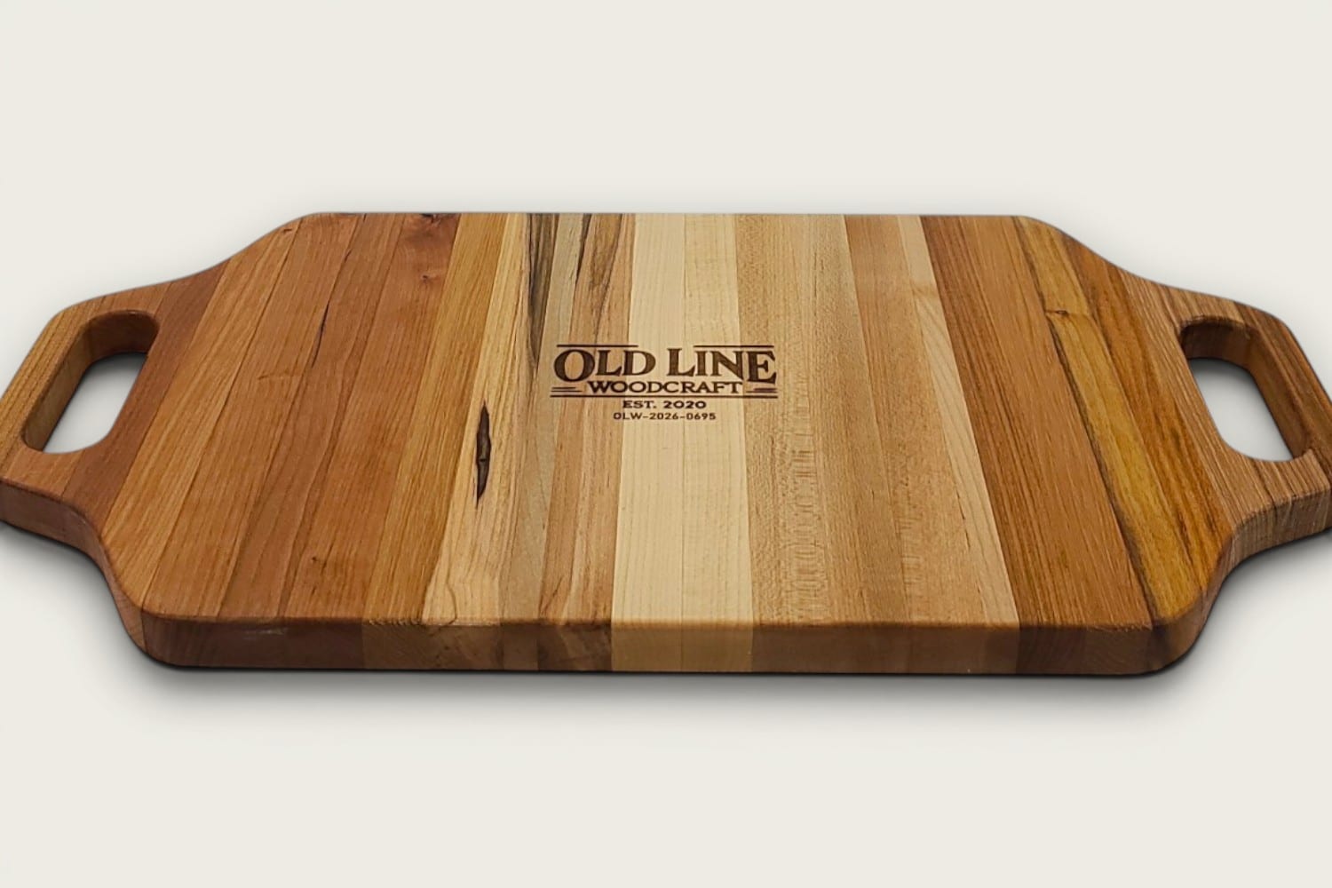 Maple Heritage Charcuterie Board, edge-grain with vertical stripes, tung-oil finish, cutout handles.