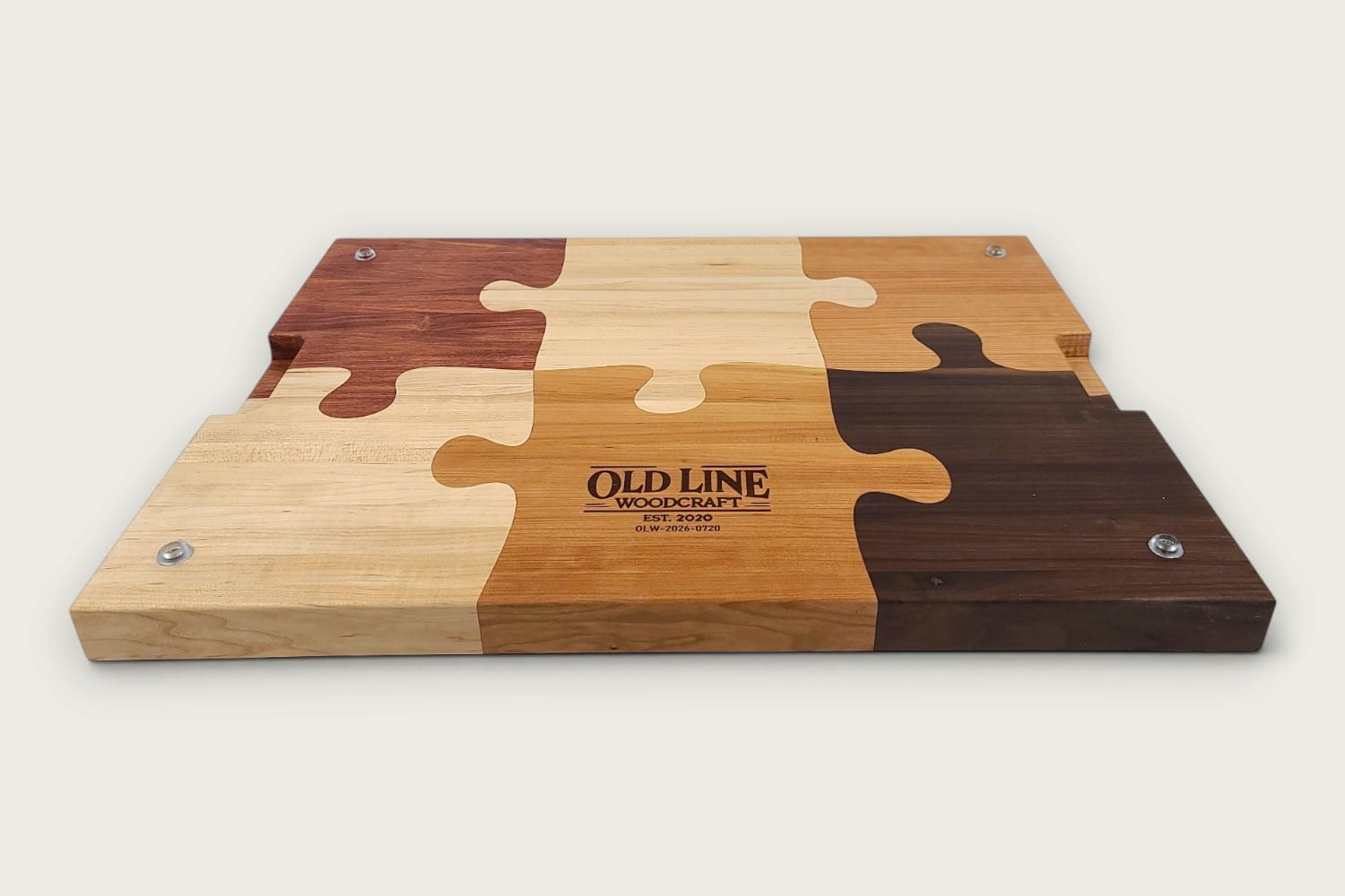 The Pitmaster Butcher Block Puzzle Board, cherry edge grain, tung-oiled rectangle with checker puzzle inlay.